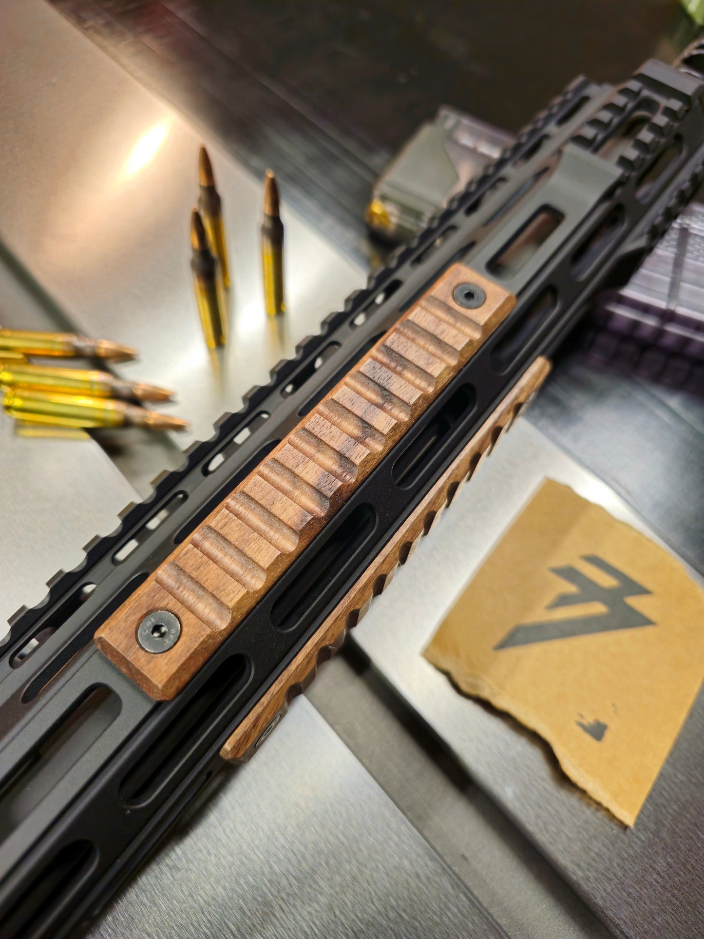 Large Grooves style walnut m-lok handguard covers. 3 slot