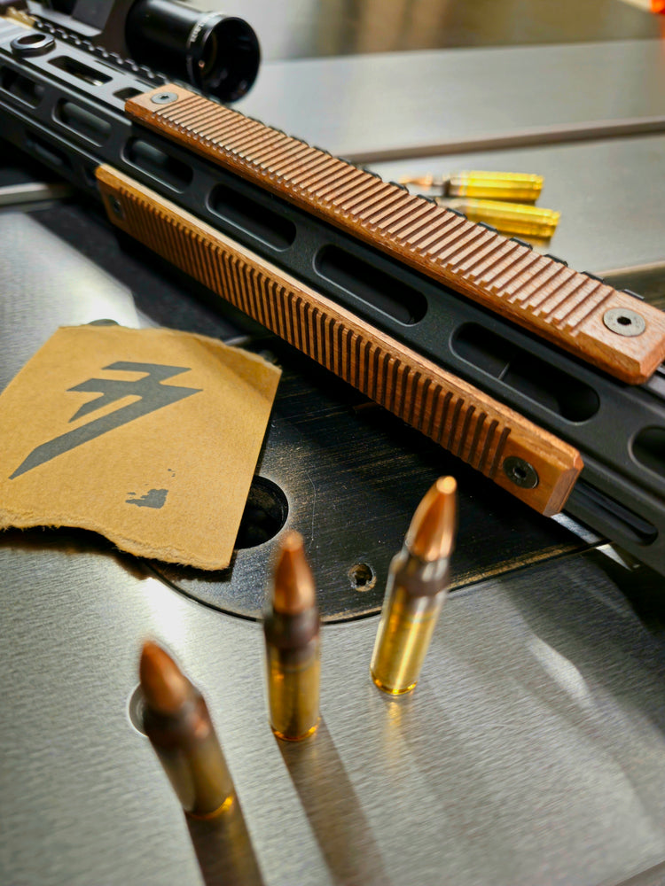 Side view of a set of walnut mlok rail covers. This set is in the regular wood color style with the lines texture profile