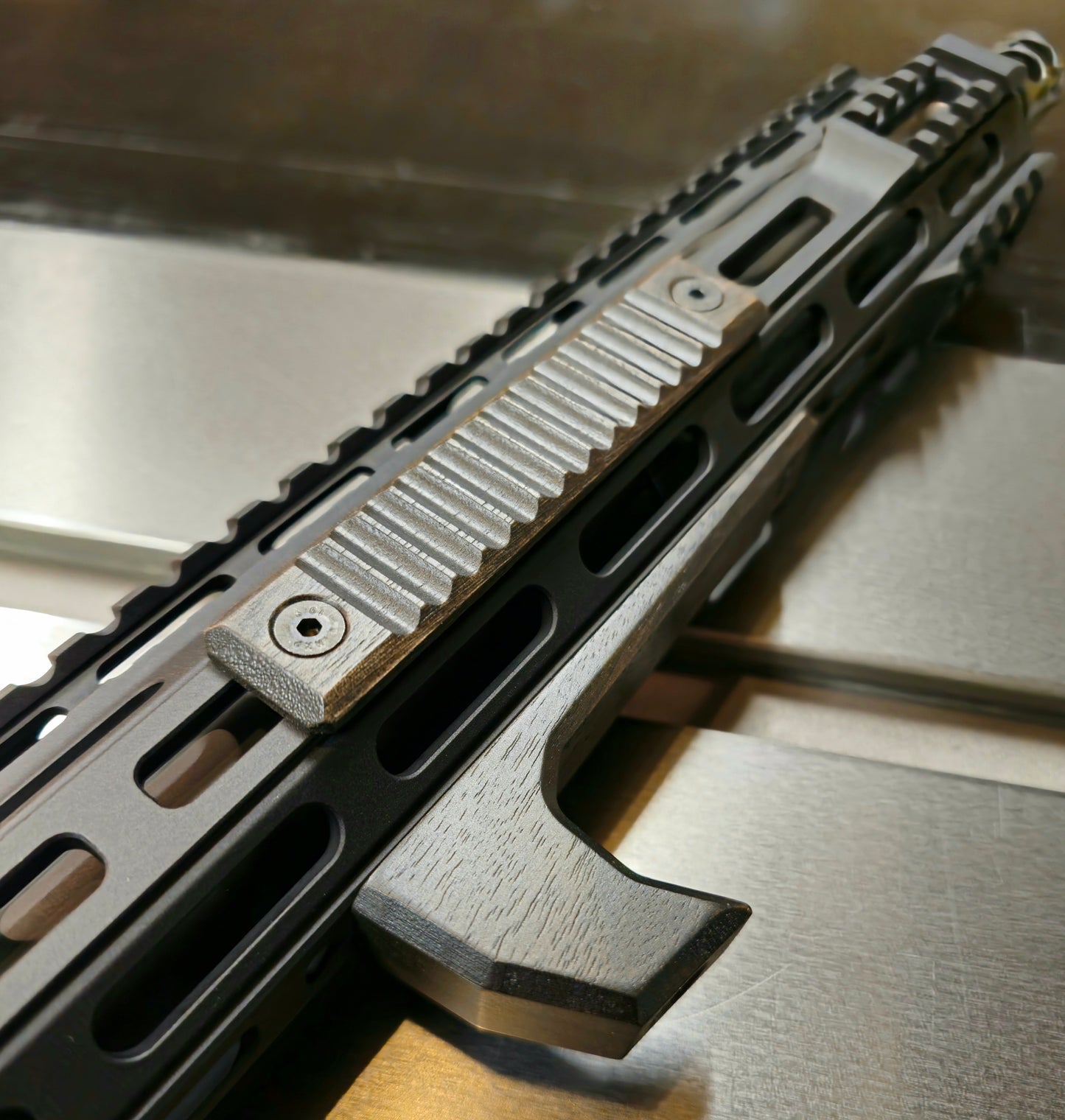 Ribbed blackout style 2.5 mlok slot panels. Walnut