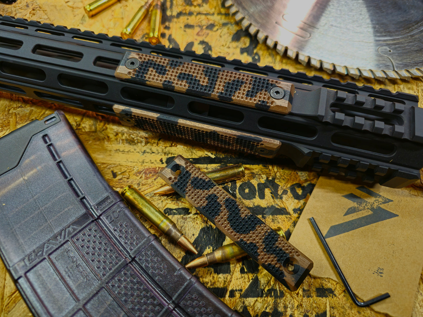 Black camo 2 slot rail panel mounted to a m-lok ar15 handguard