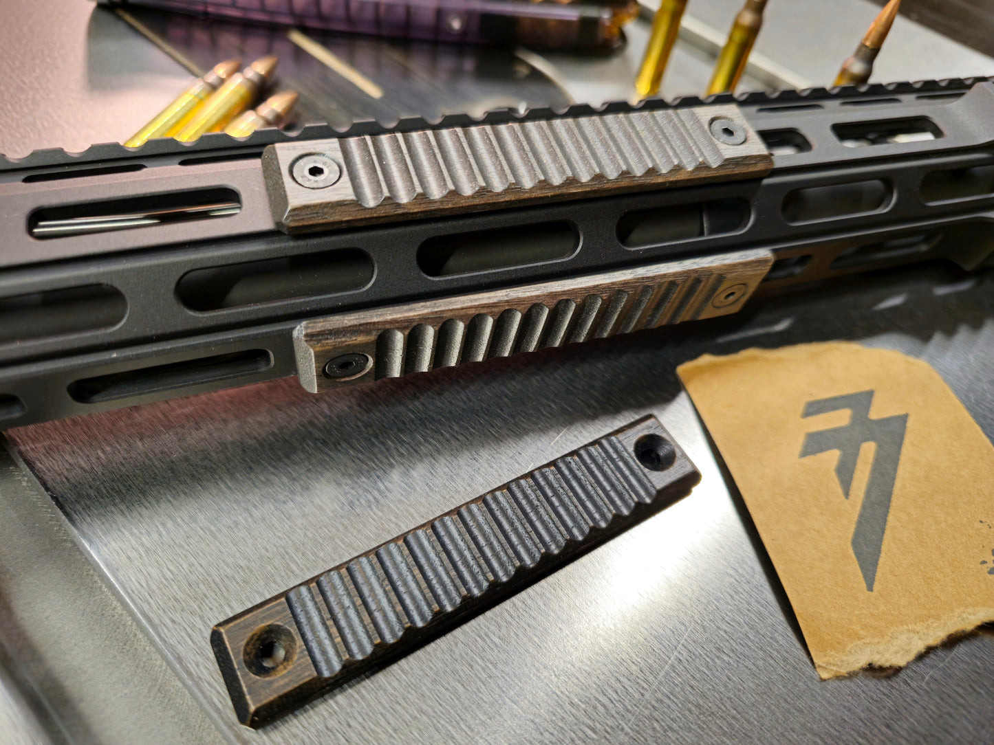 Set of blemished 2.5 mlok slot rail covers, black walnut Ribbed texture blackout color